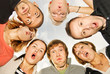 Photo: Group of happy friends making surprised faces Group of happy friends making surprised faces