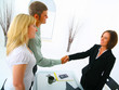 professional caucasian couple with broker in purchasing a house