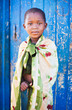 african boy living in a very poor community