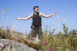 A beautiful boy enjoying the nature in the mountain