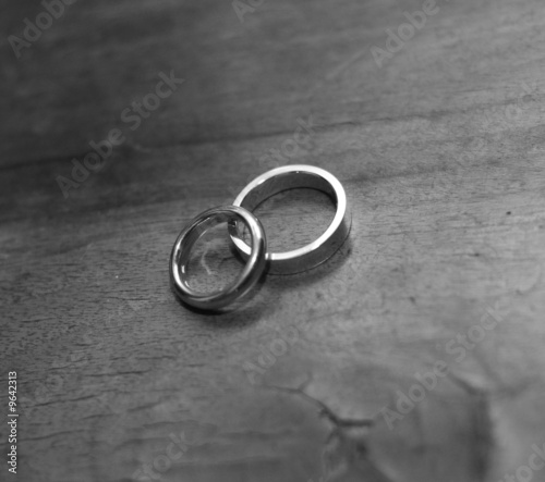 blackandwhite picture of wedding rings on a table