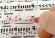 music notes composition on paper being written or marked music notes composition on paper being written or marked