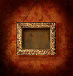 Gilded picture frame on antique wallpaper background Gilded picture frame on antique wallpaper background