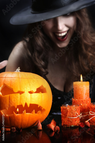 Photo : young witch on halloween night young witch on halloween night