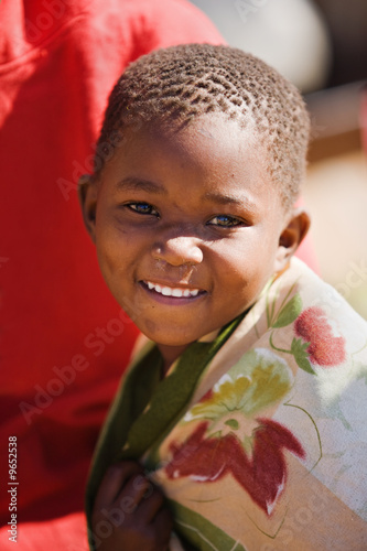african boy living in a very poor community