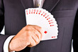 Business man with card and he has an ace up his sleeve