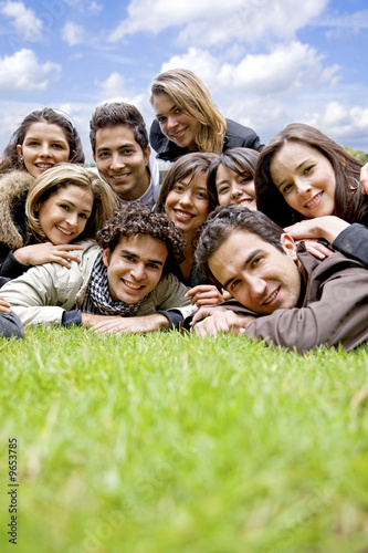 Photo: happy group of friends smiling outdoors in a park happy group of friends smiling outdoors in a park