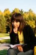 Photo: Cute girl reading a book Cute girl reading a book