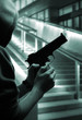 Boy with a gun at street at night