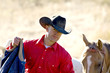 Cowboy and his horse out working
