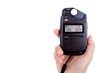 hand holding lightmeter isolated on white background
