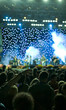 Photo: Concert stage lights out of focus and people crowd in blur Concert stage lights out of focus and people crowd in blur