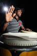 Portrait of young cuban percussionist performing live