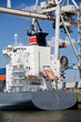 container ship in port under container lift terminal