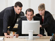 Photo: Co-workers collaborating about business problem Co-workers collaborating about business problem