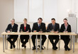Photo: Panel of co-workers about to conduct a job interview Panel of co-workers about to conduct a job interview
