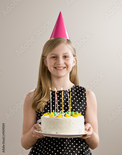 Birthday Cake 6 Candles. Birthday girl holds irthday