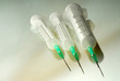 three disposable syringes are isolated