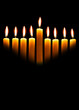 Hanukkah candles over black background with space for your text
