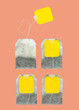 Four teabags on pink background