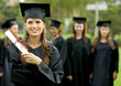 graduation group of students with a woman leading smiling
