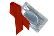 Red Ribbon with silver condom on a white background