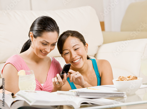 Photo: Sudents taking a break from homework by text messaging Sudents taking a break from homework by text messaging