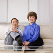 Happy couple relaxing on sofa in livingroom
