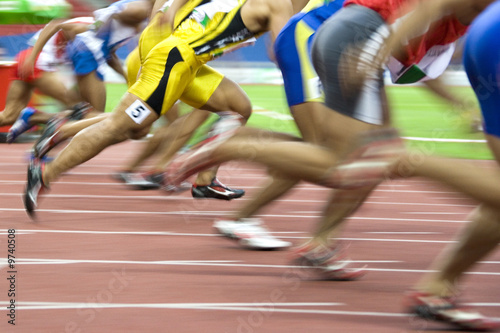 Photo: 100 meters athletes in action with intentional blurring. 100 meters athletes in action with intentional blurring.