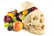 A human skull with skullcap filled with fruits and vegetables. A human skull with skullcap filled with fruits and vegetables.