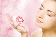 Beautiful young woman with pink orchid Beautiful young woman with pink orchid