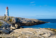 Heritage lighthouse on a rocky beach. Peggy's Cove, Canada.