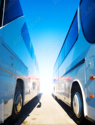 Two tourist buses. Wide angle view.
