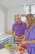 Man and woman in kitchen.