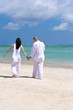 romantic couple walking on the beach