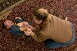mother tickling her son's bare feet on the carpet mother tickling her son's bare feet on the carpet