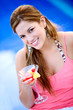 beautiful blonde woman enjoying a cocktail while on holidays