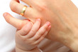 mother hand holding a new born baby hand