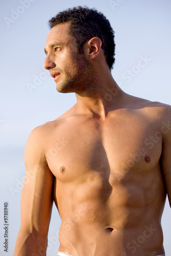 Photo: fashion muscular man portrait at the beach fashion muscular man portrait at the beach