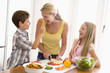 Mother And Children Prepare A meal,mealtime Together Mother And Children Prepare A meal,mealtime Together