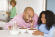 Photo: Father Sitting With Daughter As She They Eat Breakfast With Her Father Sitting With Daughter As She They Eat Breakfast With Her