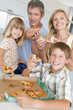 Photo: Family Eating Pizza Together Family Eating Pizza Together
