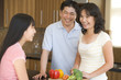 Family Laughing While Preparing meal,mealtime