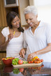 Mother And Daughter Preparing A meal,mealtime Together