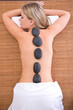 hot stone massage concept with a beautiful woman