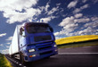 Photo: truck driving at dusk/motion blur truck driving at dusk/motion blur