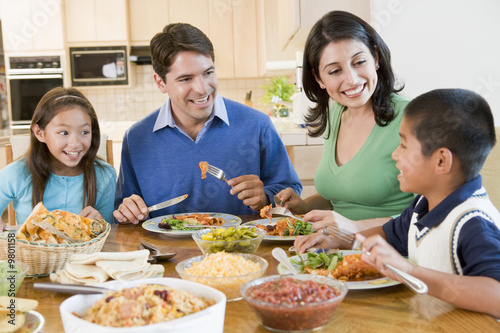 Photo: Family Enjoying meal,mealtime Together Family Enjoying meal,mealtime Together