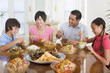 Photo: Family Enjoying meal,mealtime Together Family Enjoying meal,mealtime Together