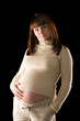 happy pregnant woman portrait isolated on black background