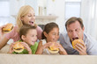 Photo: Family Eating Cheeseburgers Together Family Eating Cheeseburgers Together